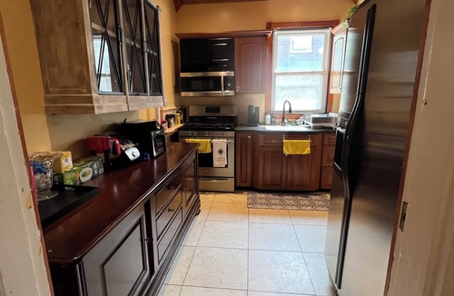 Historic Hill Condo | Wrap around deck with sunset view