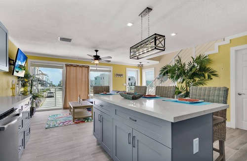 Sunrise Point House | Yellow 3 Story Home