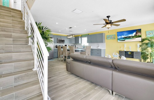 Sunrise Point House | Yellow 3 Story Home