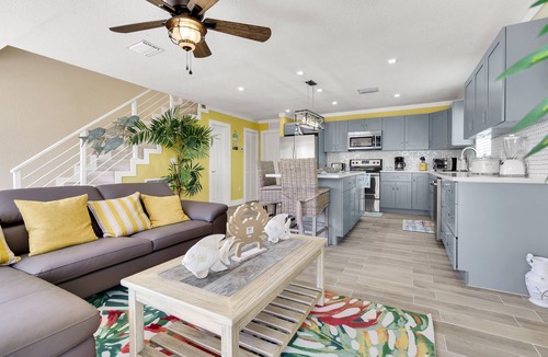 Sunrise Point House | Yellow 3 Story Home