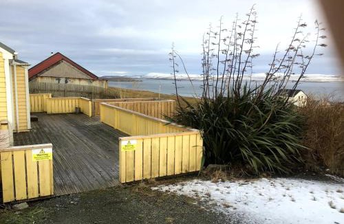 Shetland Islands House | Yellow house on the hill