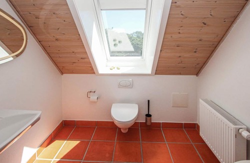 Langemark Apartment | You dream of a vacation with a view over green meadows? Then this vacation apartment on the golf cou