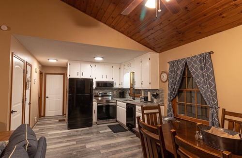 Martin House | Young@Hart is a Lakefront home w/Covered Dock, Game Room, 4 Kayaks & Hot Tub!