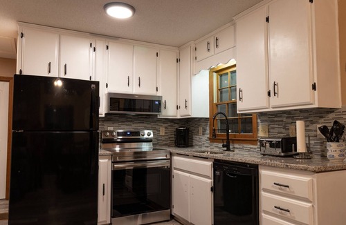Martin House | Young@Hart is a Lakefront home w/Covered Dock, Game Room, 4 Kayaks & Hot Tub!