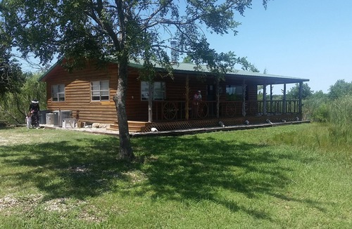Fittstown Cabin | Your own private lakefront log cabin on a 1155 acre ranch.