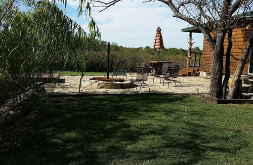 Fittstown Cabin | Your own private lakefront log cabin on a 1155 acre ranch.