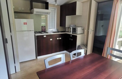 Ucel House | ZEcamping 4* piscine chauffée locatif TV clim 28m2