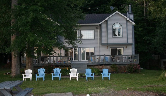 1 acre of level property, 339' of private waterfront and easy beach level access