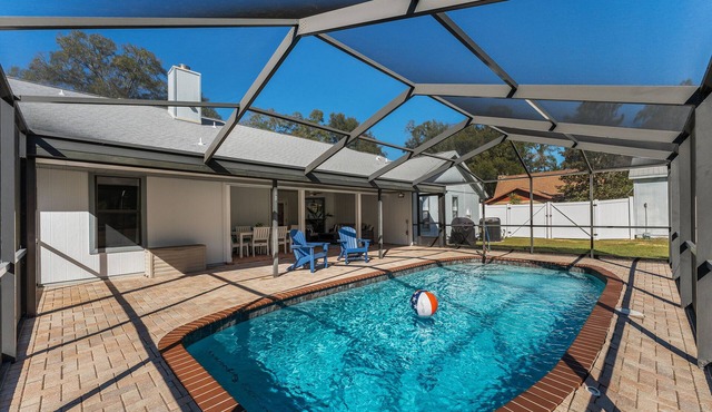 1 acre private retreat with pool, firepit, volleyball, basketball & open concept