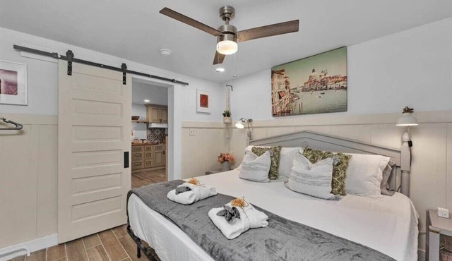 1 bedroom, 1 bathroom sleeps max 4 guests with the sleeping arrangements being a king bed and futon that sleeps 2