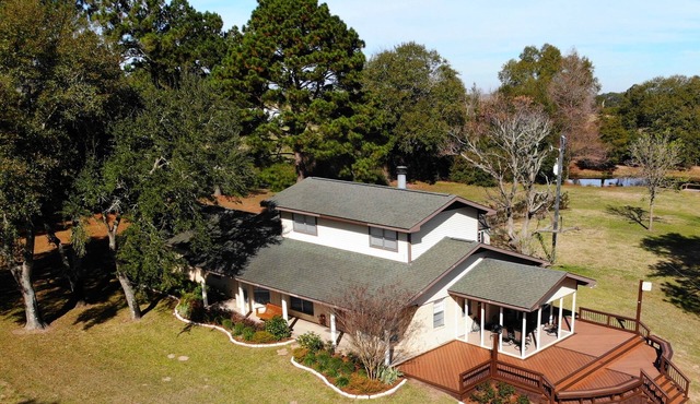 100-acre ranch with beautiful creek, ponds, woods, livestock