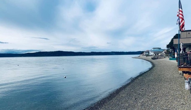 100-year-old cabin Perched on stilts above the Puget Sound.
