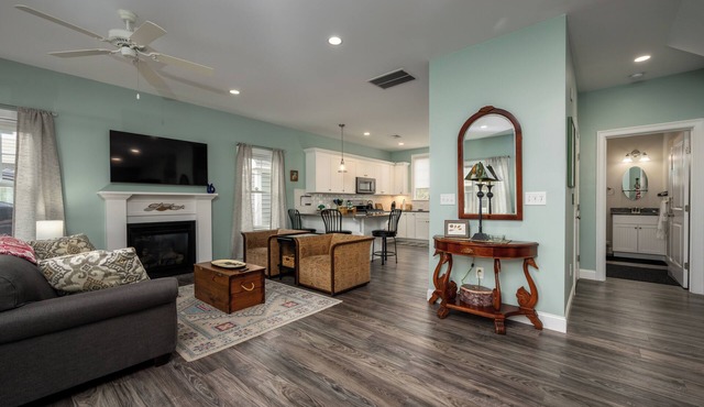 15 mins to beaches! Cozy cottage with fireplace, heated pools, gym & game room