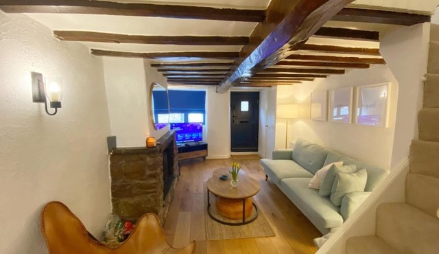 1750's cottage with open fire and beams