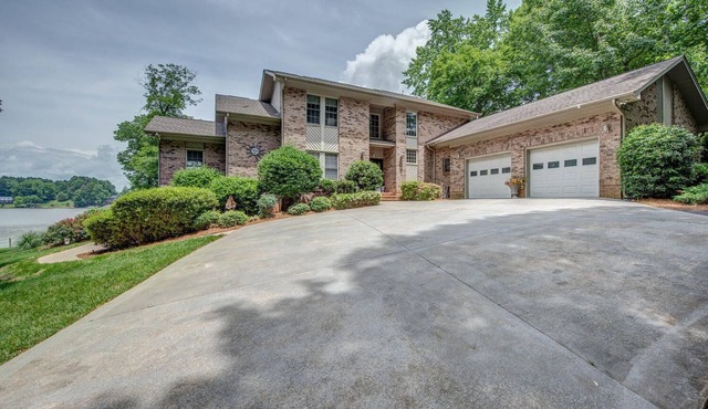 180 degree lake view, 300 ft. of shoreline, heated pool, and private beach.