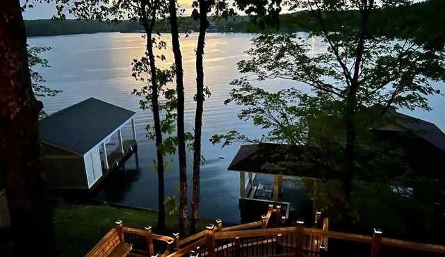 180 degree water views await in this 4 bedroom/3 full bath Hyco Lake Cottage!