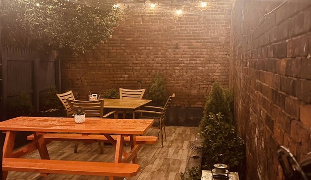1850s historic Row House 7min train to NYC with private backyard