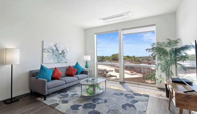 1BR City Loft With Modern Glass Views