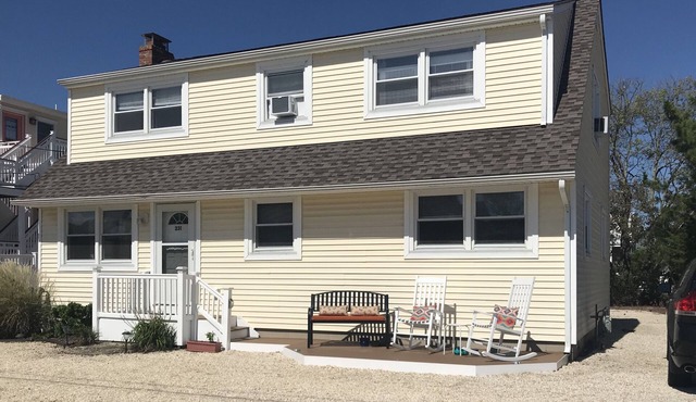 1st Fl of duplex. Sunsets over the bay, walk to beach. Great family getaway.