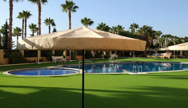 1st sea line apartment in Marina d'Or with lawn and beach [Family]