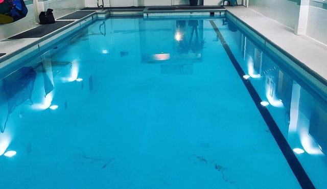 2 Bedroom Downtown Condo above Gym with Pool Hot tubs sauna etc.