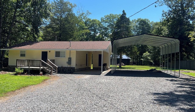 2-bedroom house in Higden with 24x30 covered parking for boats and lake toys!