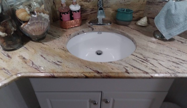 2 bedroom suite with a full kitchen, living room, and a full bathroom.