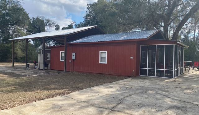 2 BR 2 Bath Cabin on private 1 acre. Huge cement pad for parking. No clay roads.