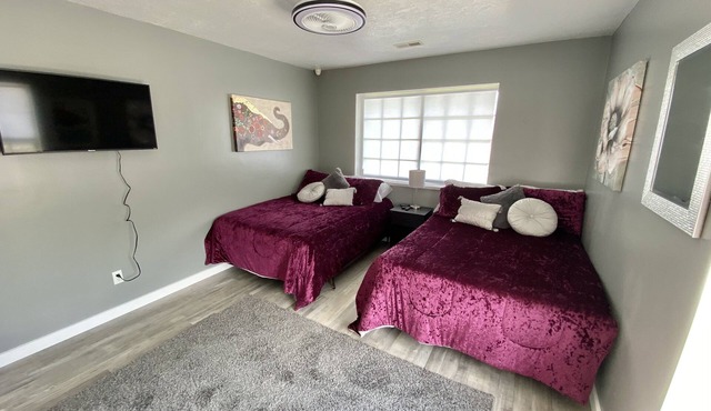 2 Double Beds Rm #4 with view of the San Rafael Swell and smart TV. India room.