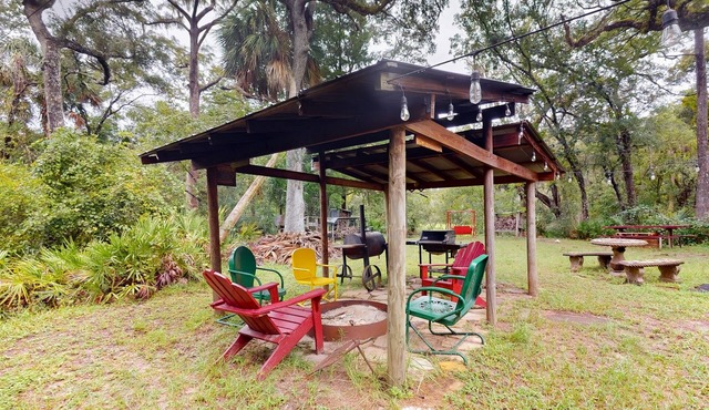 2 riverfront cabins with large yard, grill, firepit, canoe, & private W/D