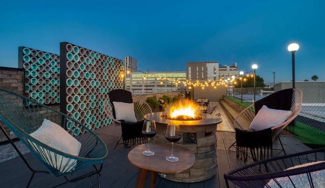 2BR Apt w/Balcony: Gym, Rooftop+Fire Pit, Lounge/Games