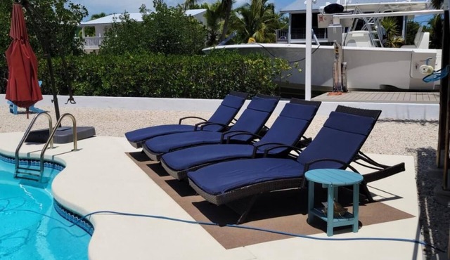 3/2 two story home with pool and 80' dock on canal ocean side.