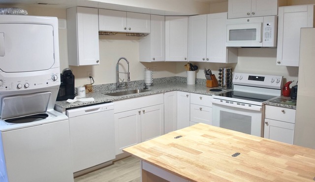 3-bed/2 bath basement apt. in charming Midvale with AC, wifi, laundry & hot tub.