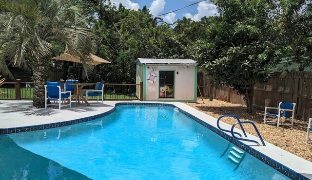 3 bed/2 bath house with tropical backyard, pool, fenced yard, hammock