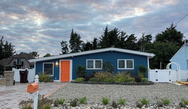 3-bed/2 bath bungalow in adorable Bayville with radiant floor heat & fireplace.