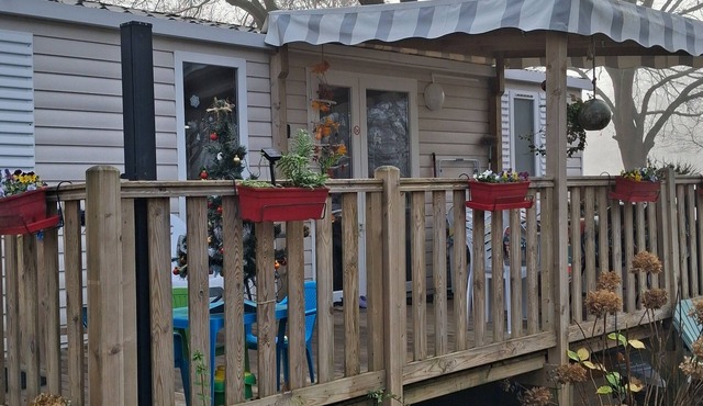 3-bedroom mobile home, sleeps 6 in wooded campsite overlooking lake.