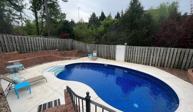 3 bedroom, 2.5 bathroom patio home with an inground pool. The sleeping arrangements at this property include three queen beds and a futon located in the second living room.
