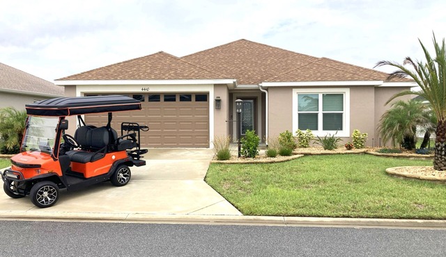 3 BEDROOM 2 BATH DESIGNER in THE VILLAGES with 2-CAR Garage & ELECTRIC GOLF CART