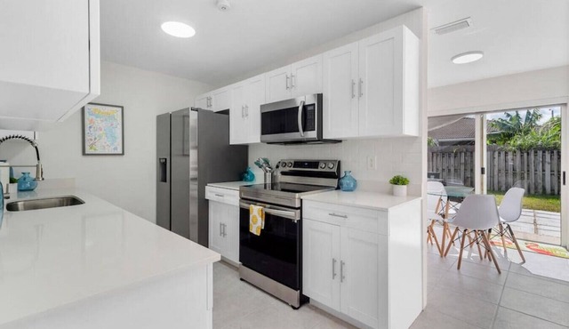 3 Bedroom 2 Bathroom with a BRAND NEW POOL W/ a huge backyard & BBQ next to Keys