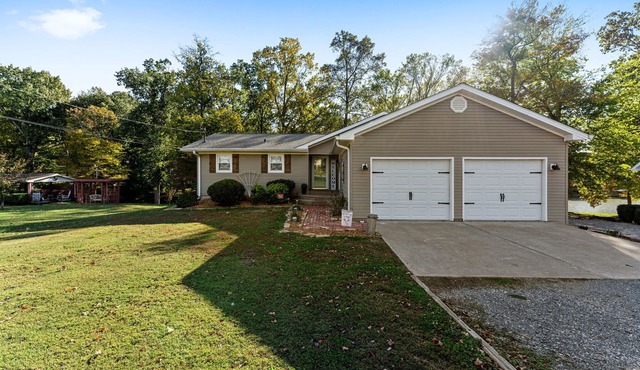 3 bedroom/2 full bath lakefront home with gentle slope to private covered dock