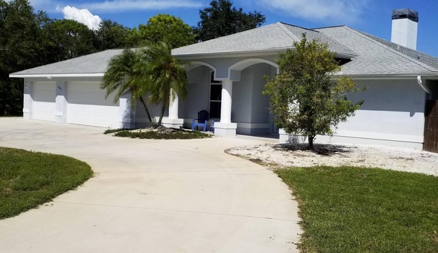 3 bedroom 3 bath house with private heated screened pool on a quiet cul de sac