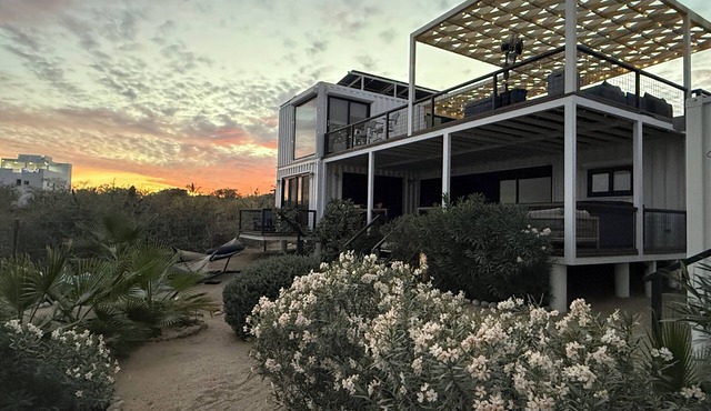 3 bedroom, 3 bath premium stylish shipping container home. Game room w/darts, shuffleboard, video game cabinet, Infinity game table, new 8 person hot tub, multiple decks w/firepits, fast Wifi (250 mb+)w/Starlink backup. Free use of two SUPs.