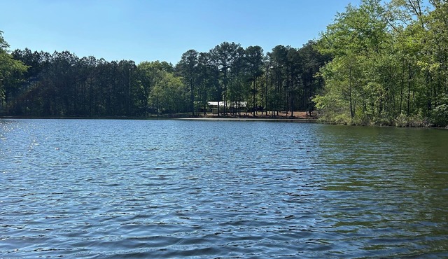 3-bedroom cabin nestled on 80 acres with WiFi, AC on private 5-acre lake.