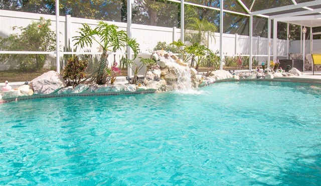 3 Bedroom Home with Private Screened Pool with Rock Waterfall Feature and Gameroom by Florida Dream.