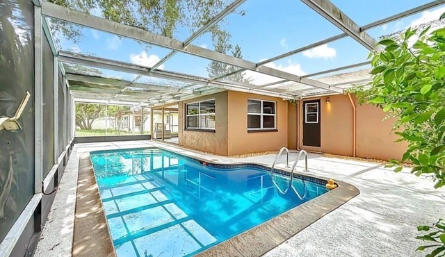 3-bedroom house in Holiday,FL with a beautiful pool oasis. Pool is not heated
