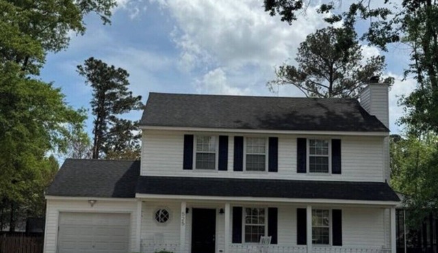3-bedroom house with back patio and screened in porch.