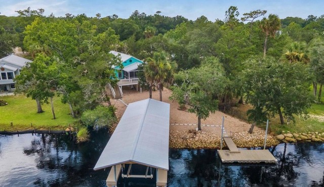 3-bedroom Riverfront home with private boat dock and view of Steinhatchee River.