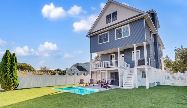 3 levels with 5 bedrooms, 4.5 baths, elevator, heated pool, and lots of gathering spaces both inside and out!