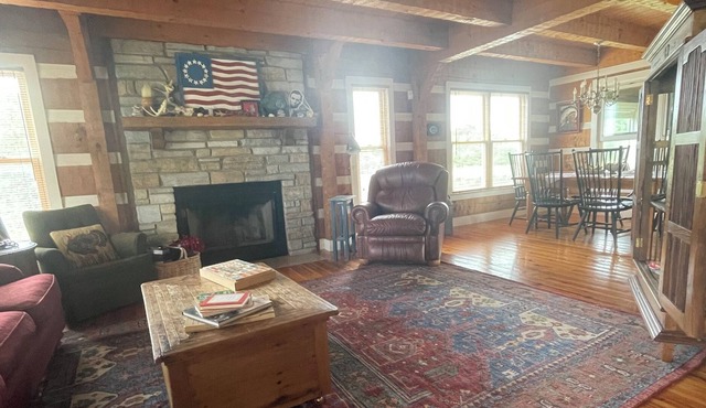 3 story log home with walkout basement, 27 acres, & pond in central Pike County!
