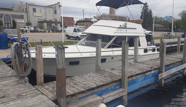 30' CARVER BOAT DOCKED AT MENOMINEE MARINA IN HISTORIC DOWNTOWN MENOMINE MI.